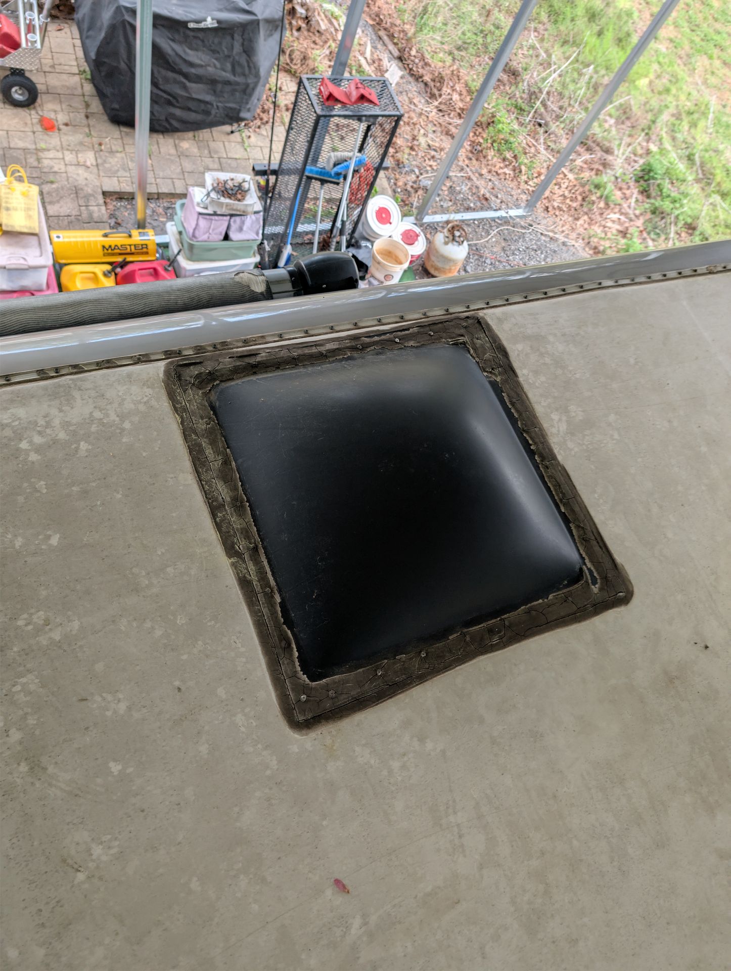 Roof tape being applied over an RV roof leak