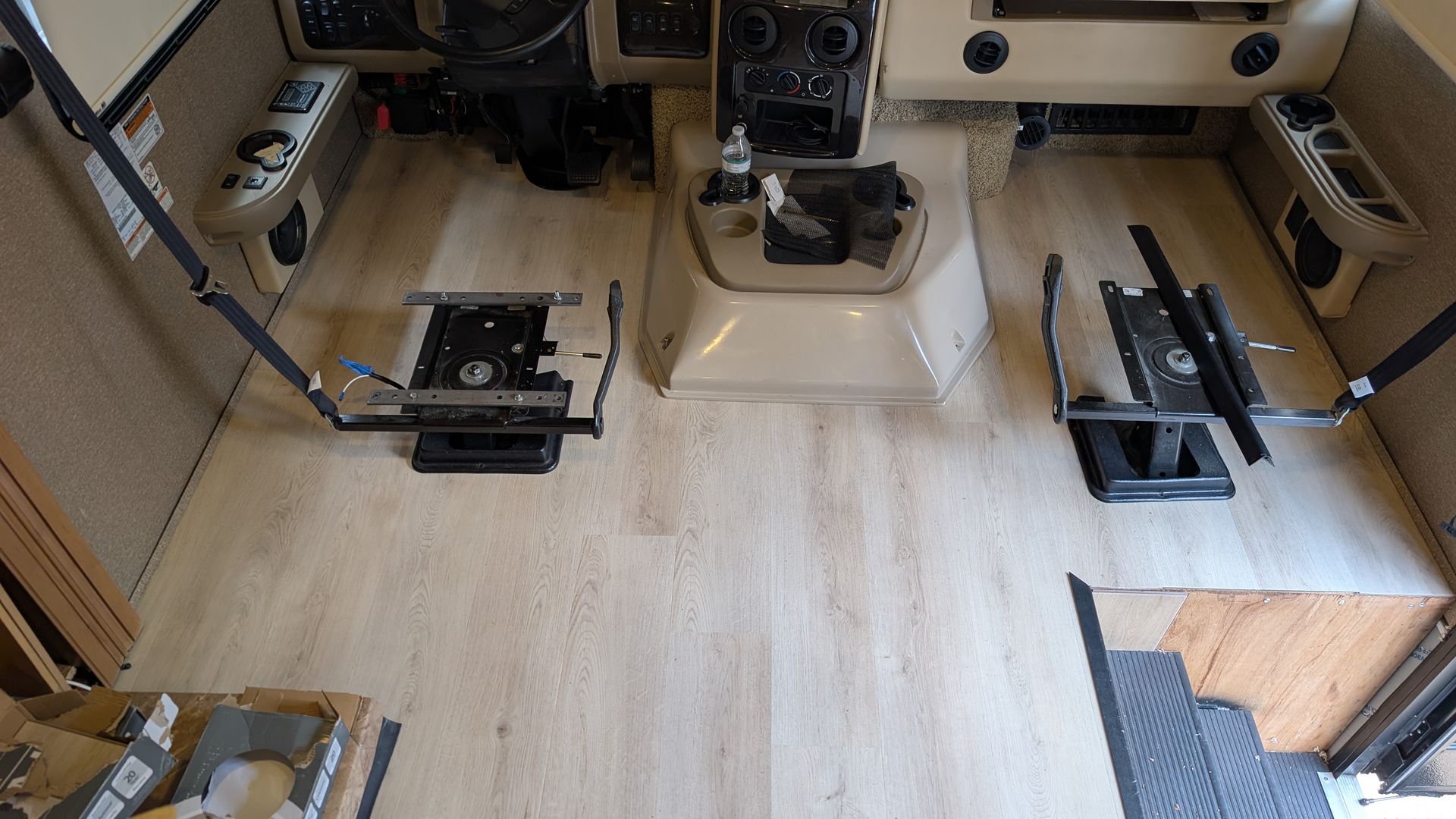Fresh luxury vinyl plank flooring laid across the floor of an RV