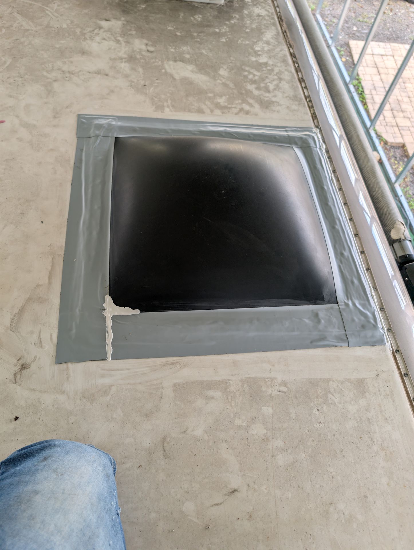Repaired RV roof seam sealed with roof tape